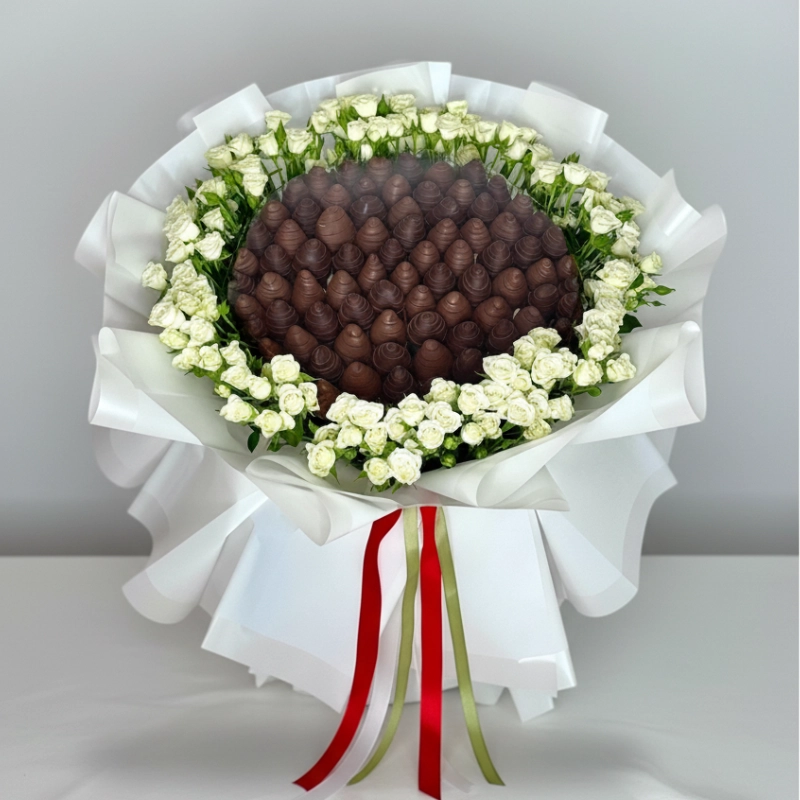 Customized bouquet with white roses and chocolate strawberries spelling Happy Birthday Zahra – by One Love, UAE